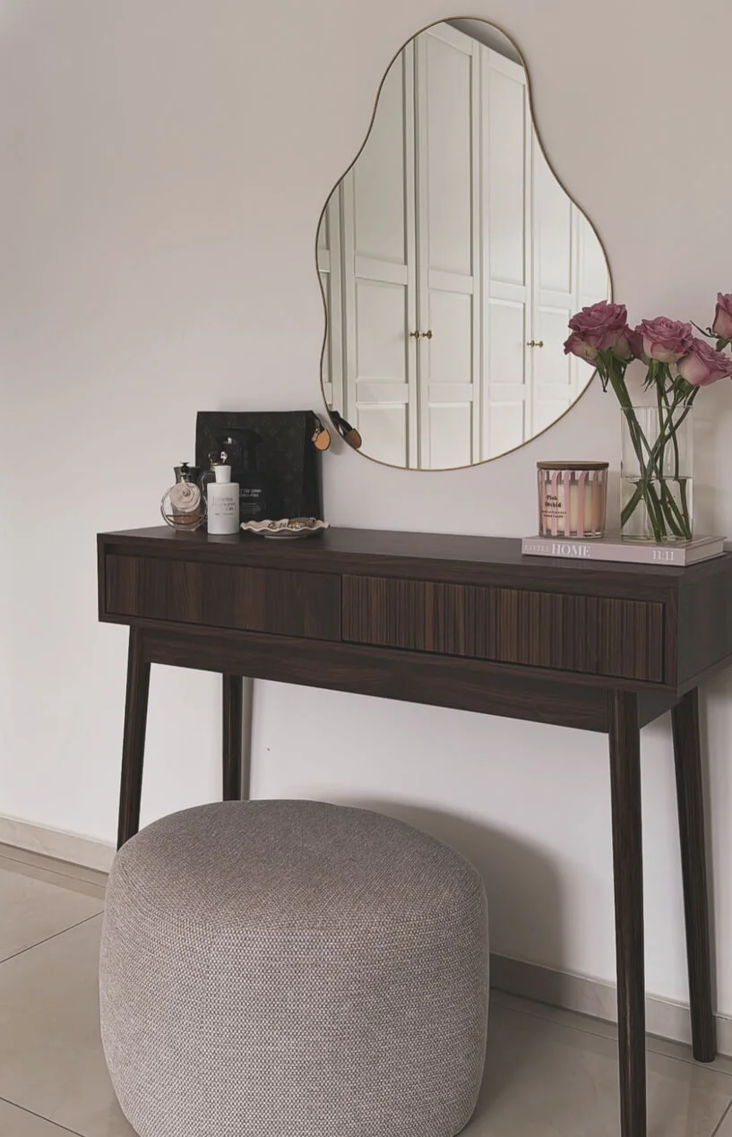 Organic Mirror Frames a Dark Wood Vanity With Delicate Details