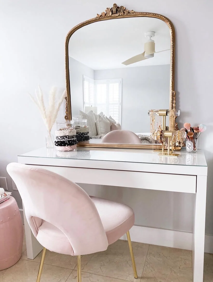 Ornate Gold Mirror Frames a Glamorous Vanity Setup