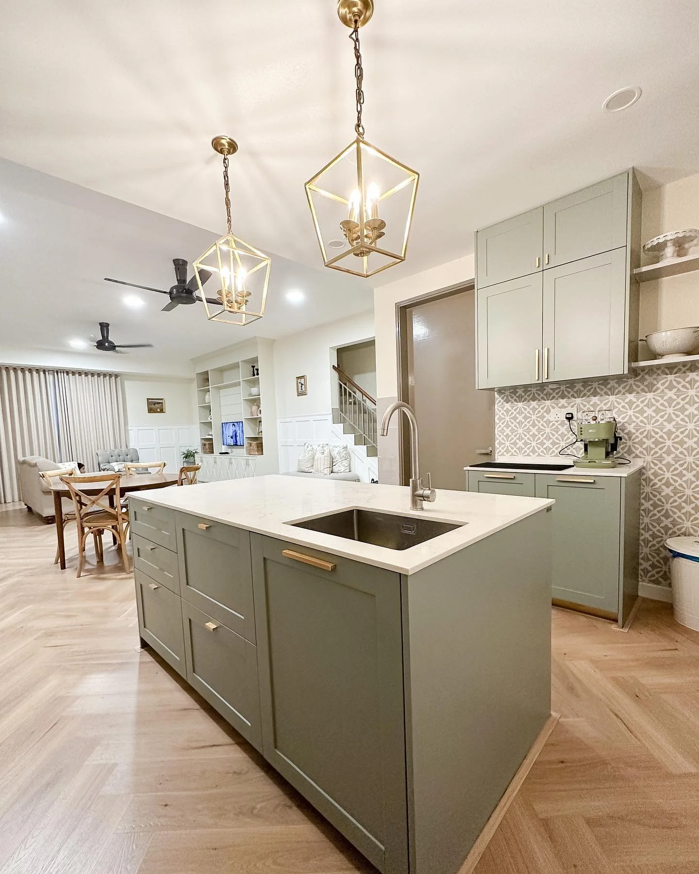 Geometric Lantern Pendants Define Open Kitchen Zones