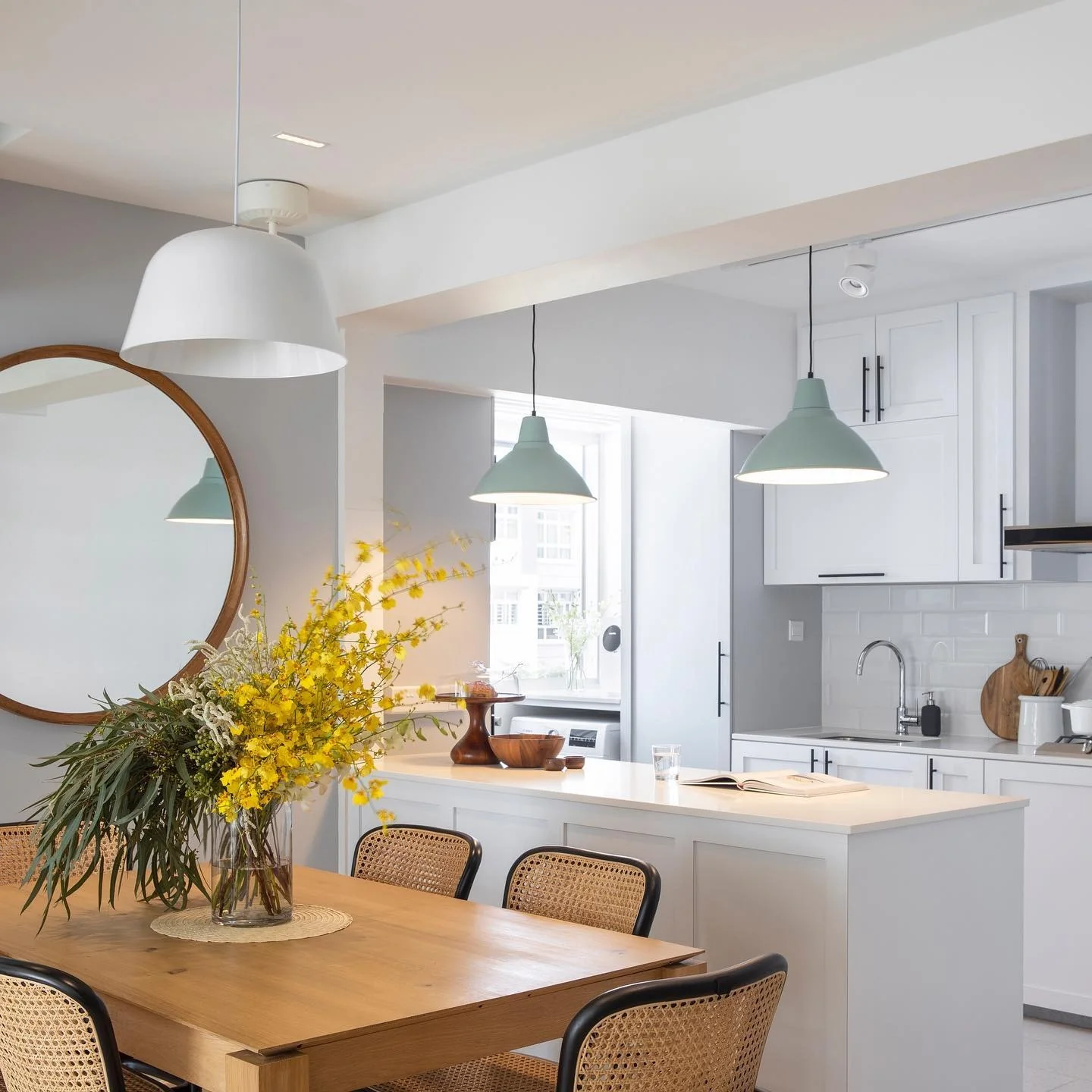 Sage Green Pendants Define Kitchen Island Zones