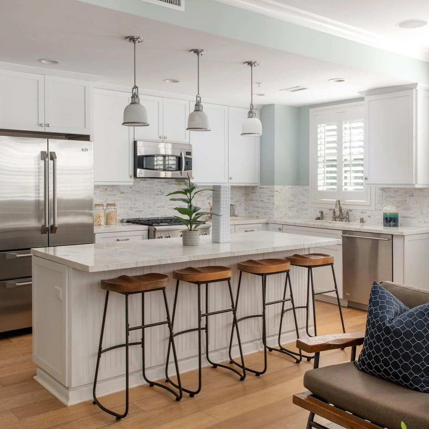 Incorporate Wooden Saddle Stools for Natural Texture