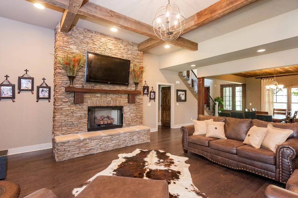 Stone Fireplace Wall Anchors the Rugged Living Space