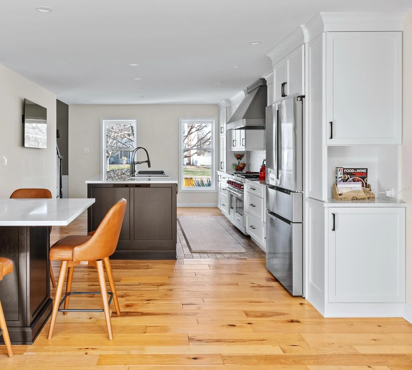 Warm Honey-Toned Wood Flooring Grounds the Kitchen