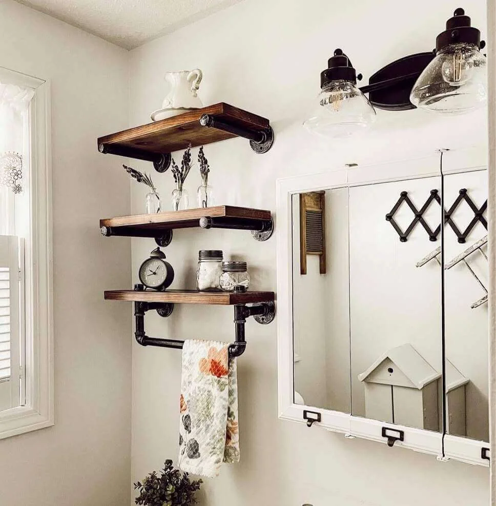 Industrial Pipe Shelves Hold a Towel Bar and Decorative Jars