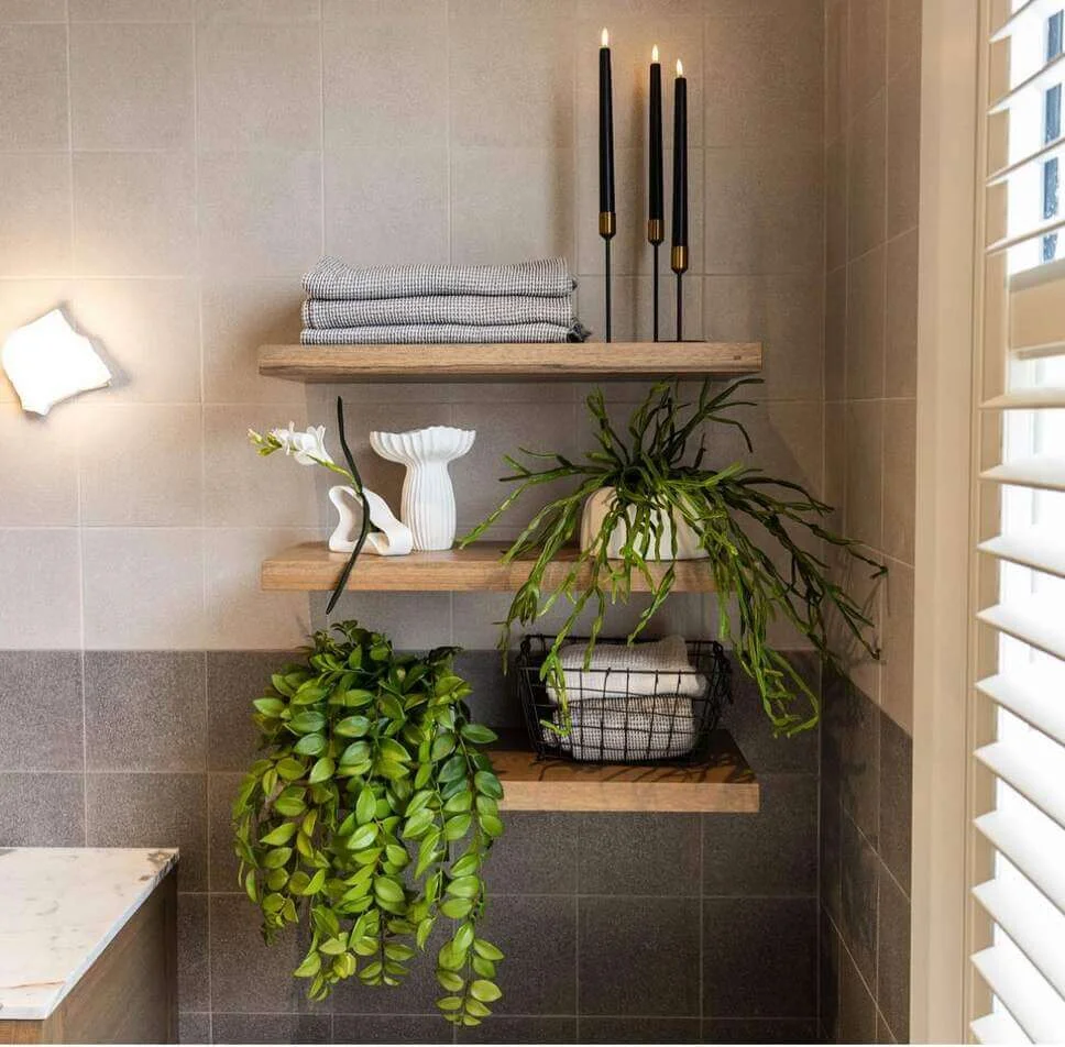 Black Taper Candles Add Vertical Interest to Wood Shelves