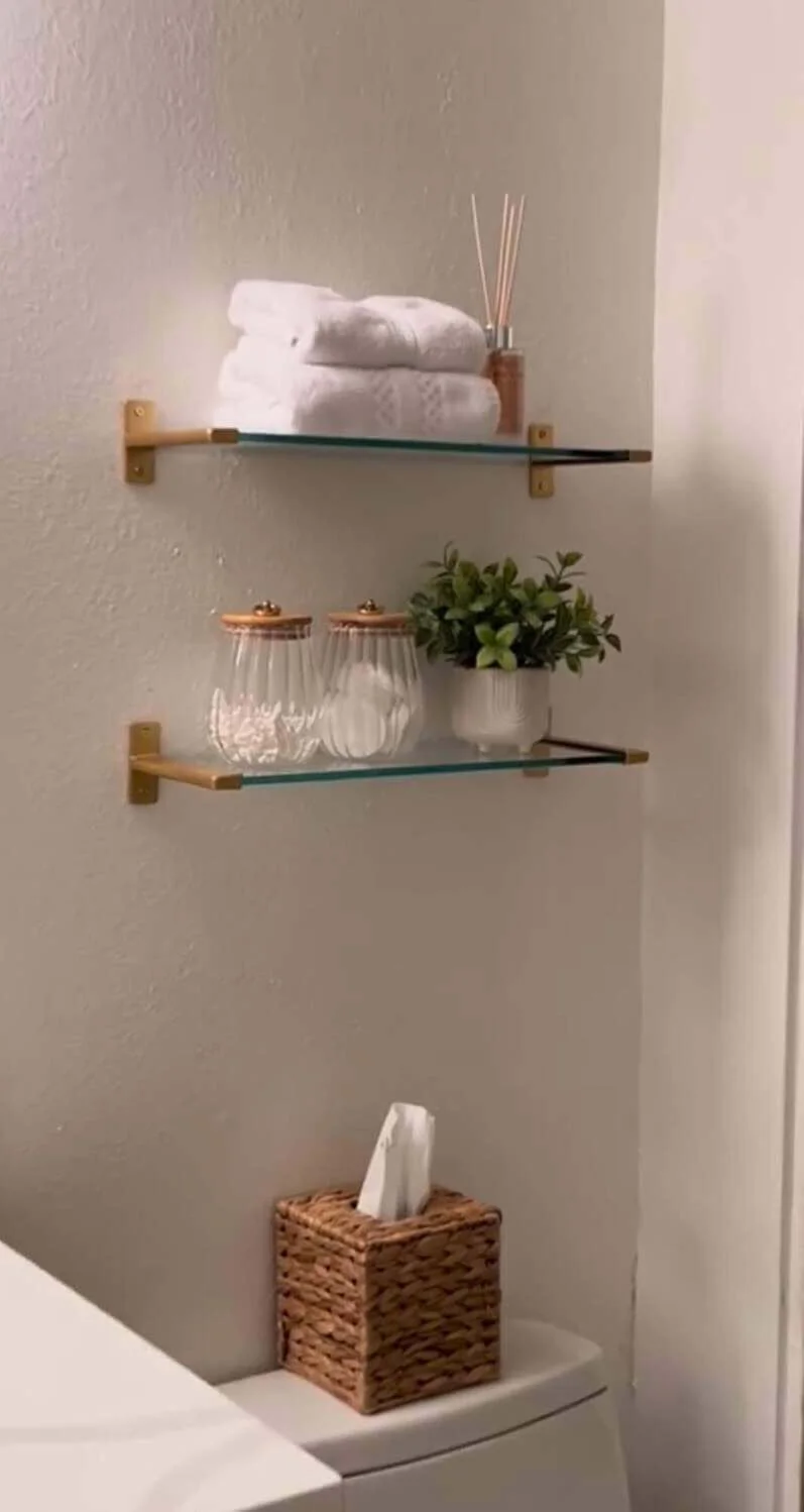 Achieve a Clean Look with Glass Shelves and Greenery