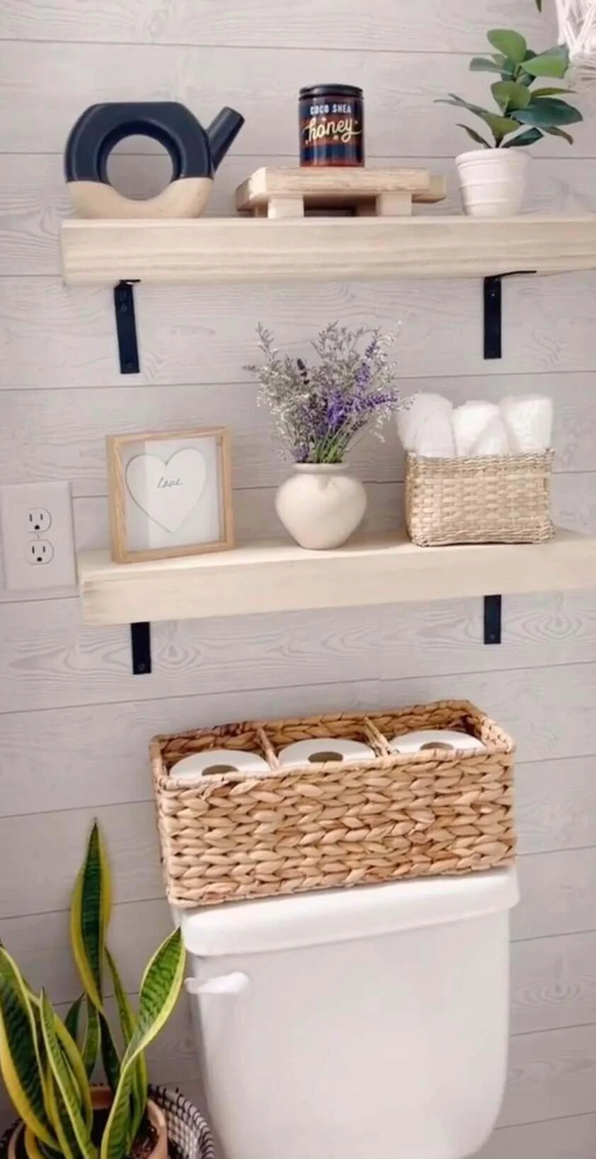 Woven Basket Holds Toilet Paper Rolls On Tank Top