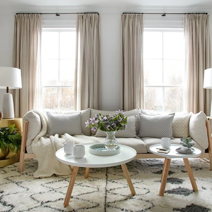 Layered White Coffee Tables Create Flexible Seating Zones