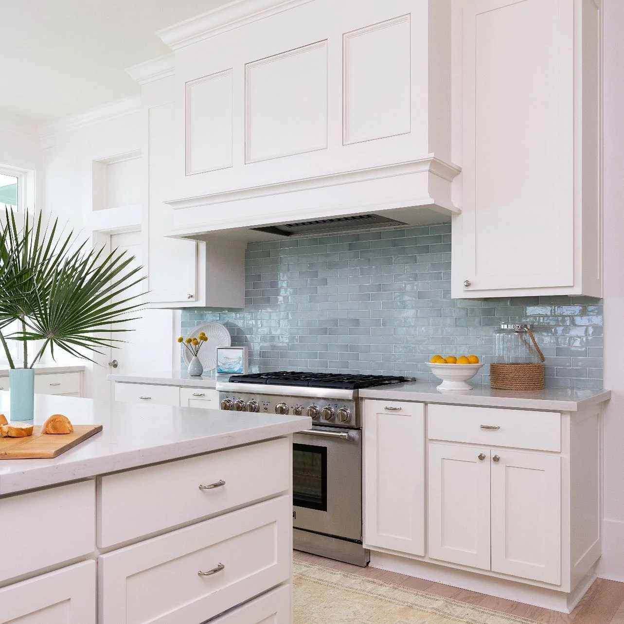 Glass-Fronted Cabinets Frame a Coastal View