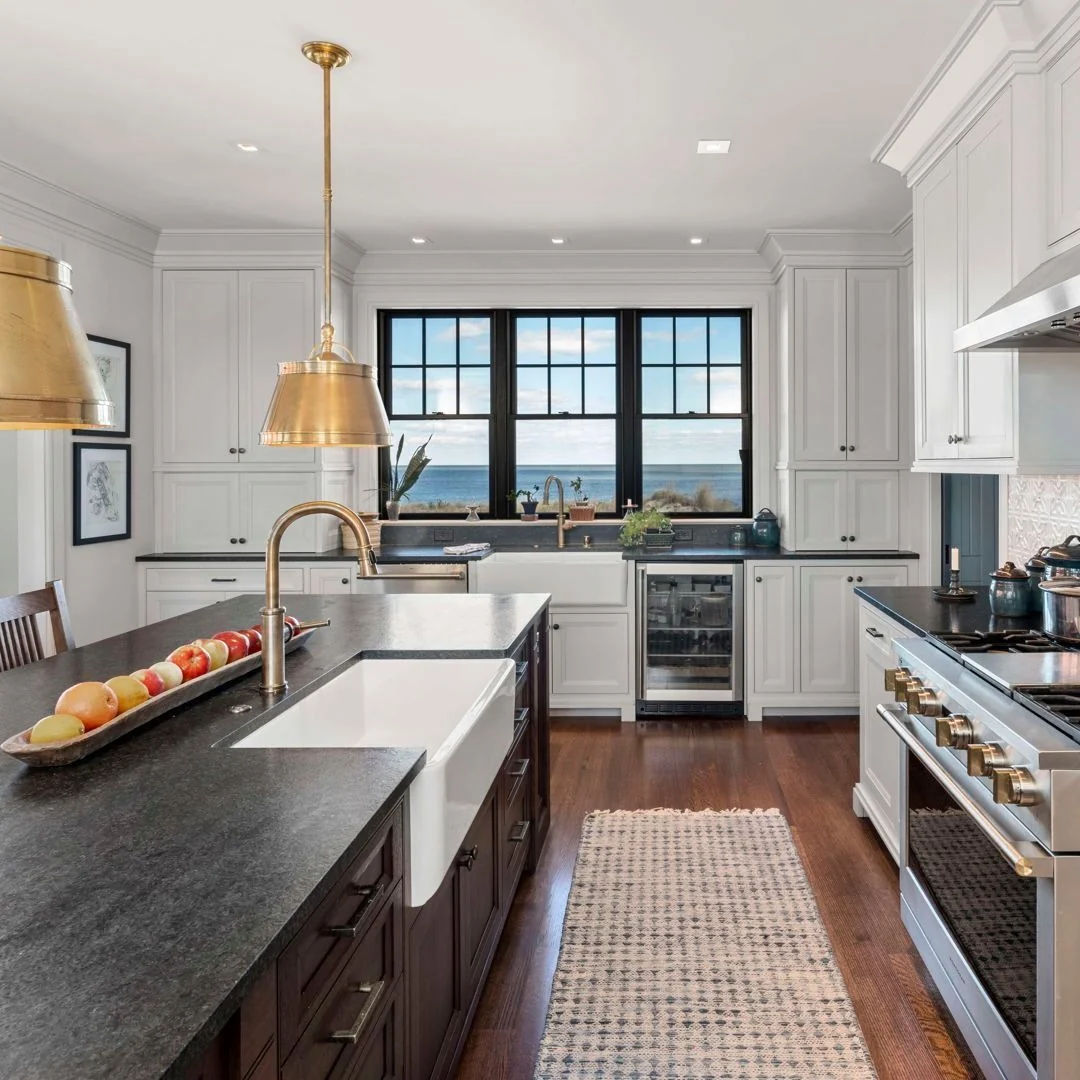 Farmhouse Sink with Dark Wood Island Anchors the Coastal Kitchen