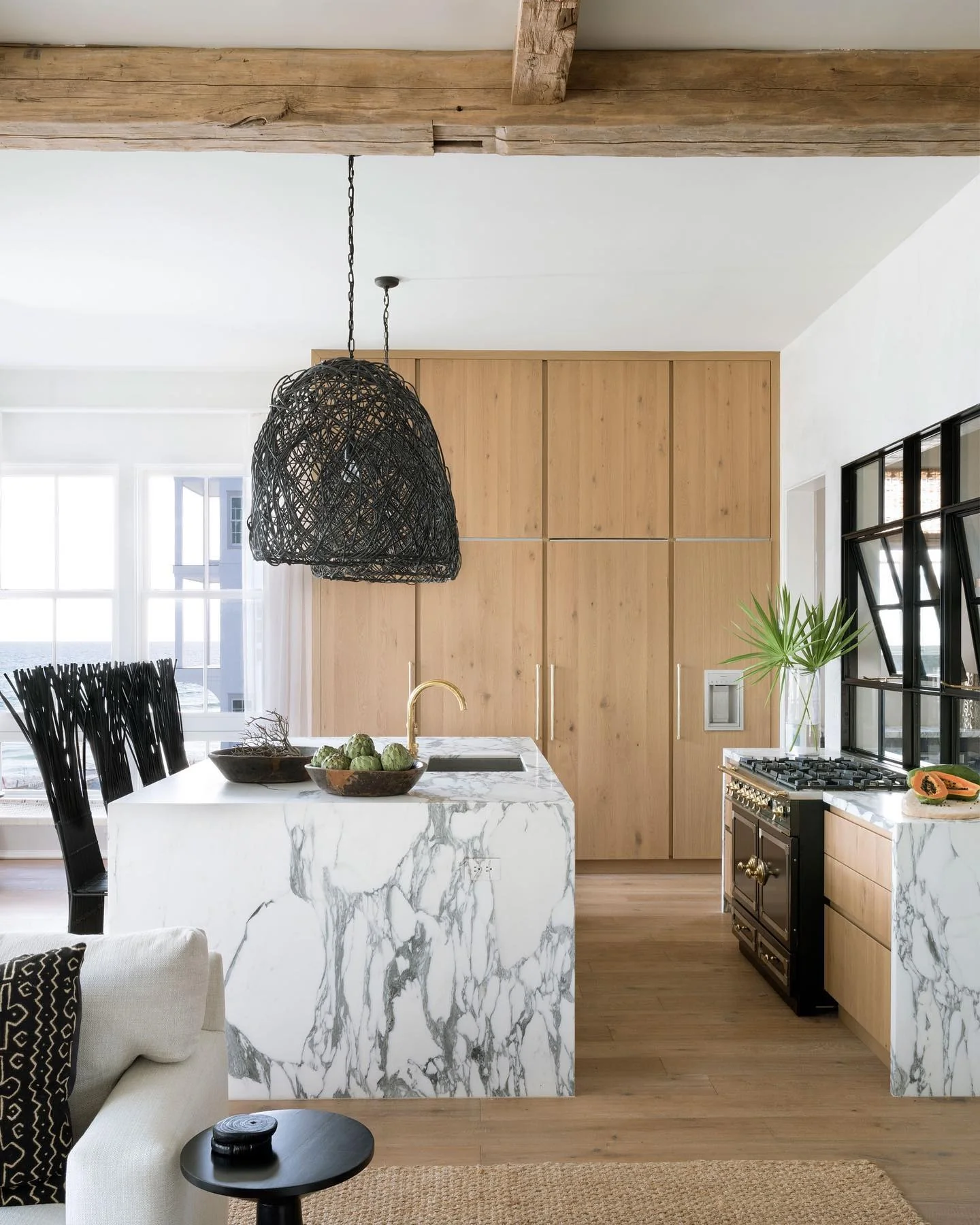Dramatic Black Pendant Lights Define the Kitchen