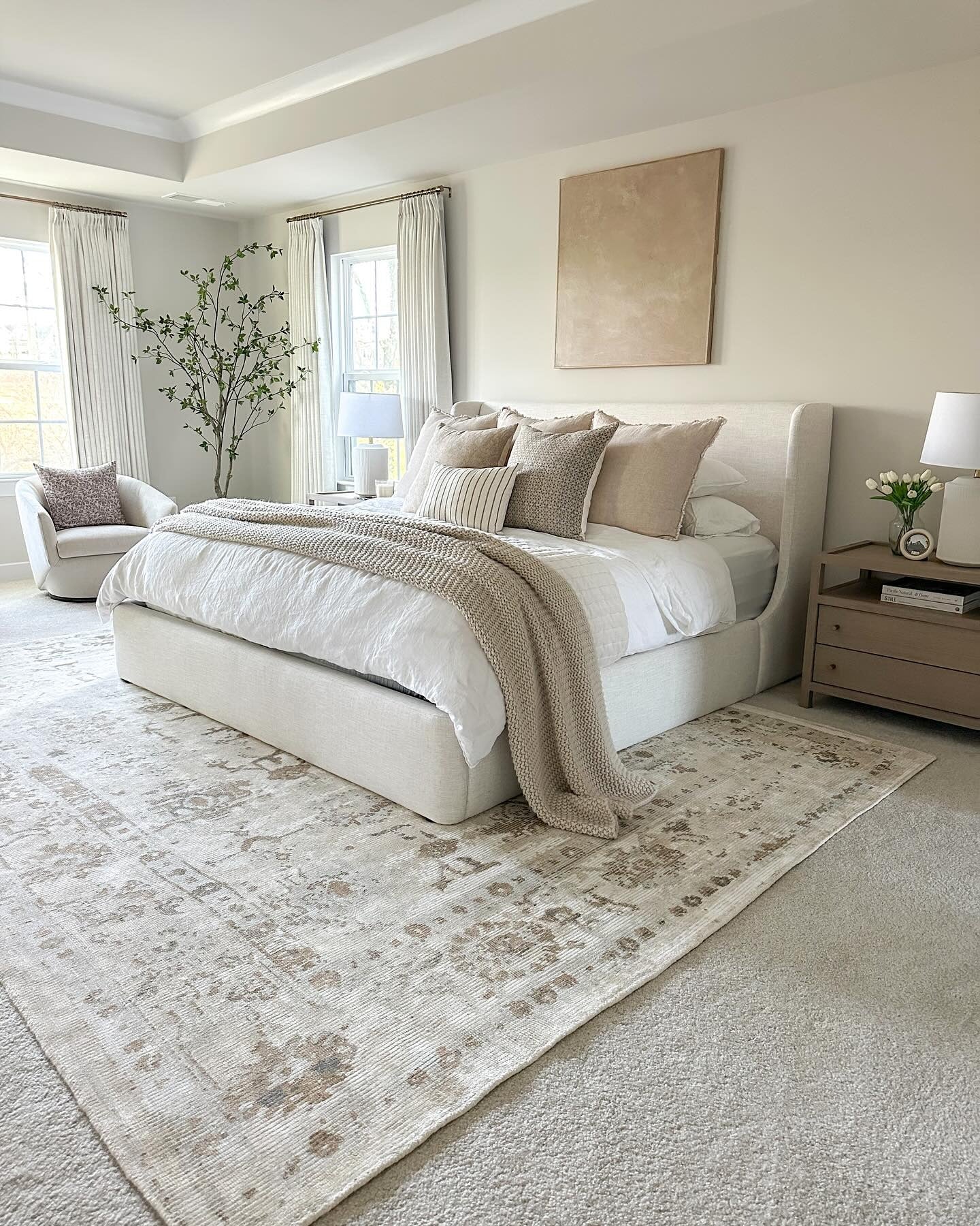 Anchor Your Cream Bedroom With Layered Area Rugs