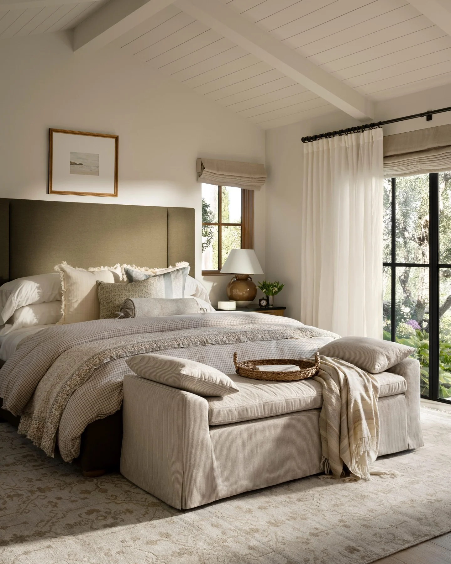 Layer Extra Pillows on a Pinstriped Cream Bench