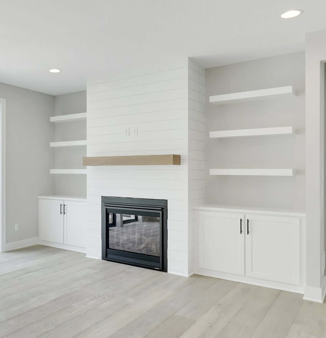 Floating Shelves Frame a Fireplace