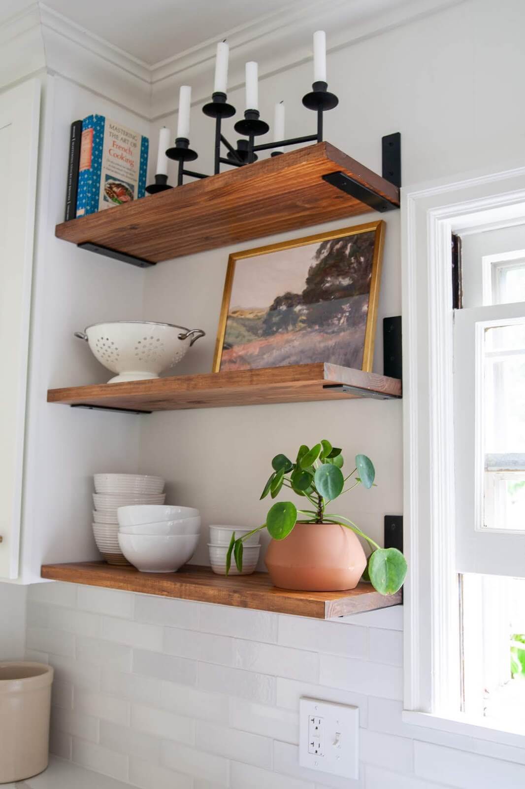 Frame Artwork and Kitchenware on Wood Shelves