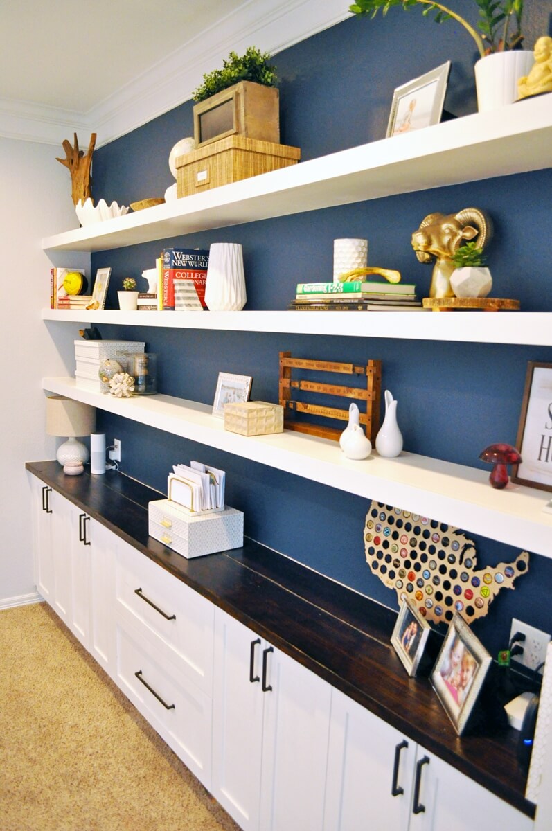 High-Contrast White Shelves on a Deep Blue Wall