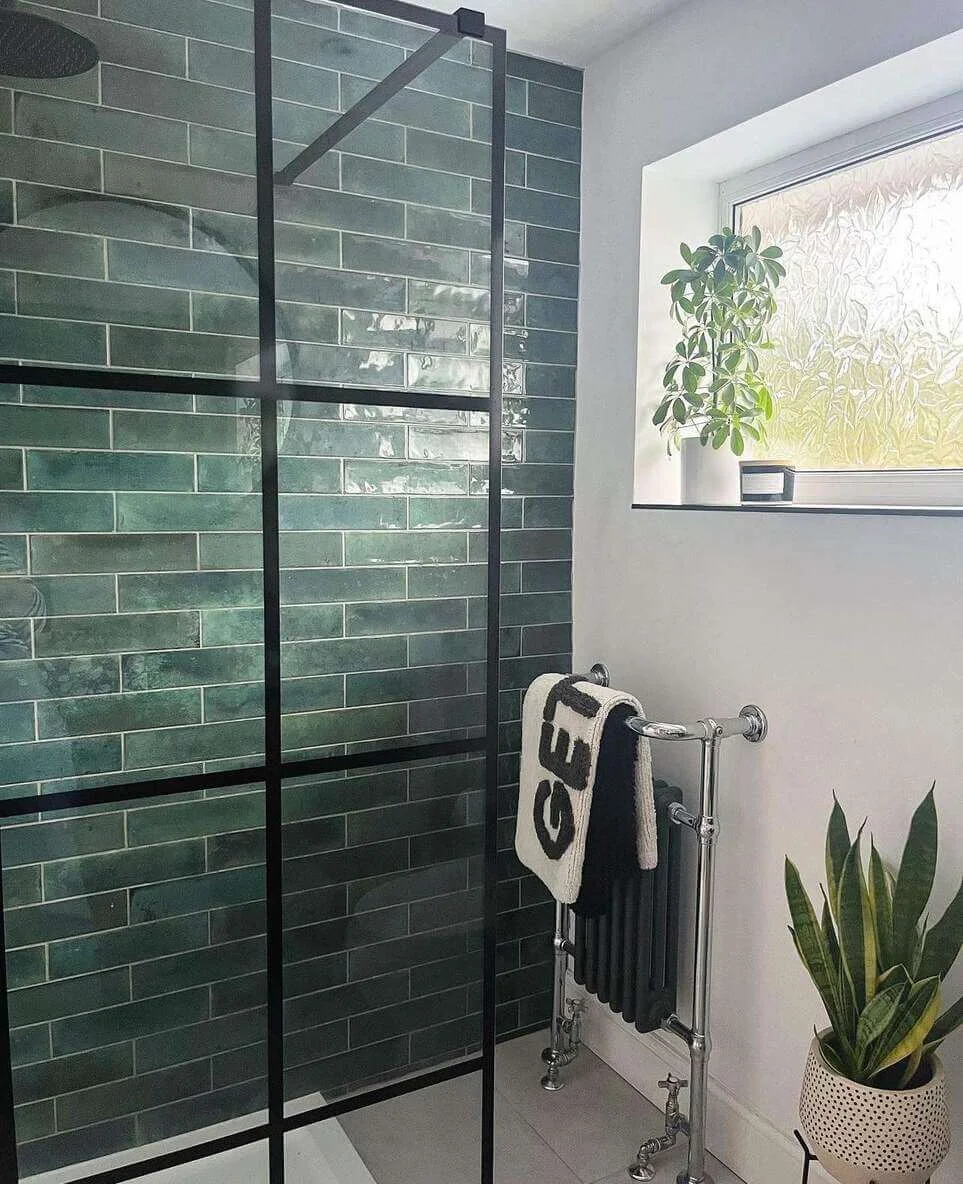 Deep Green Subway Tile Creates a Lush Shower Enclosure