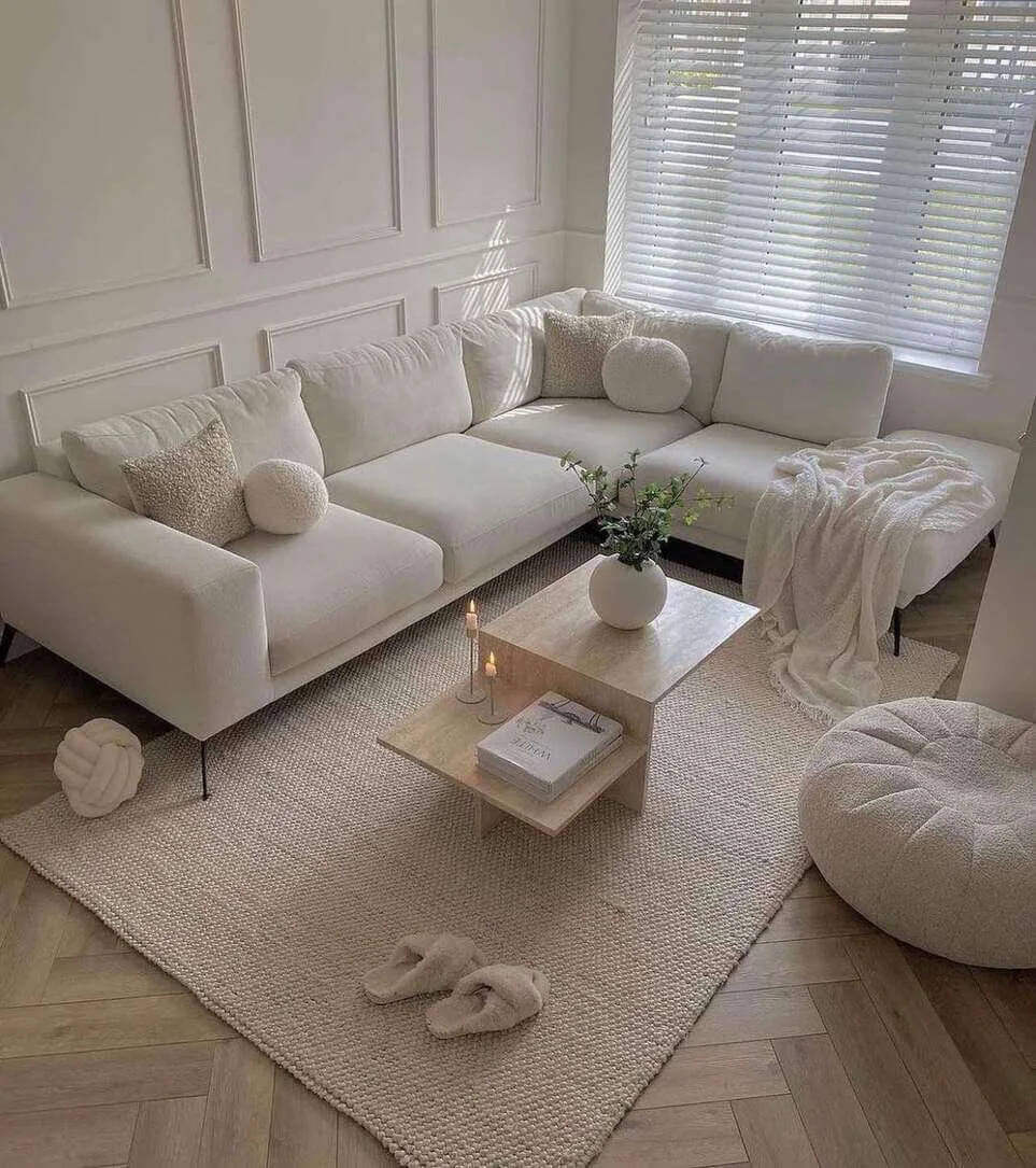 Layered Pillows Add Cozy Texture To A Neutral Sofa