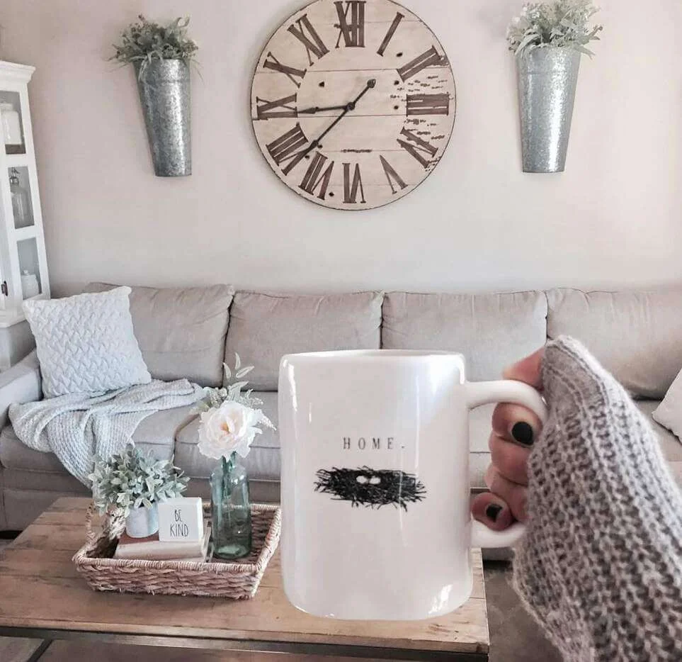 Oversized Roman Numeral Clock Anchors The Sofa