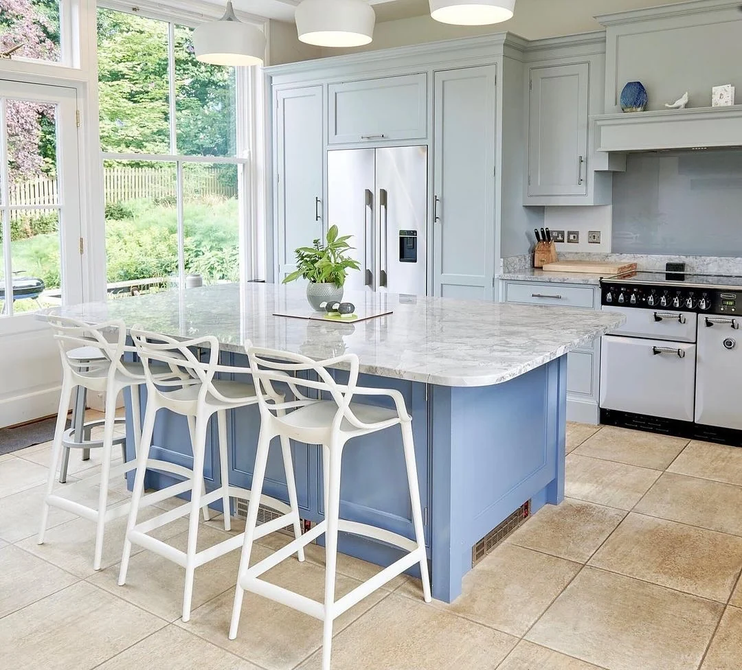 Blue Kitchen Island Anchors the Space with a Marble Countertop