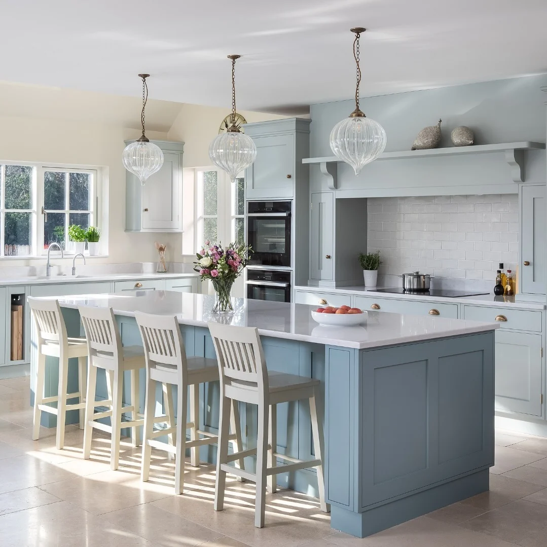 Ribbed Glass Pendants Add a Delicate Touch Above the Blue Island
