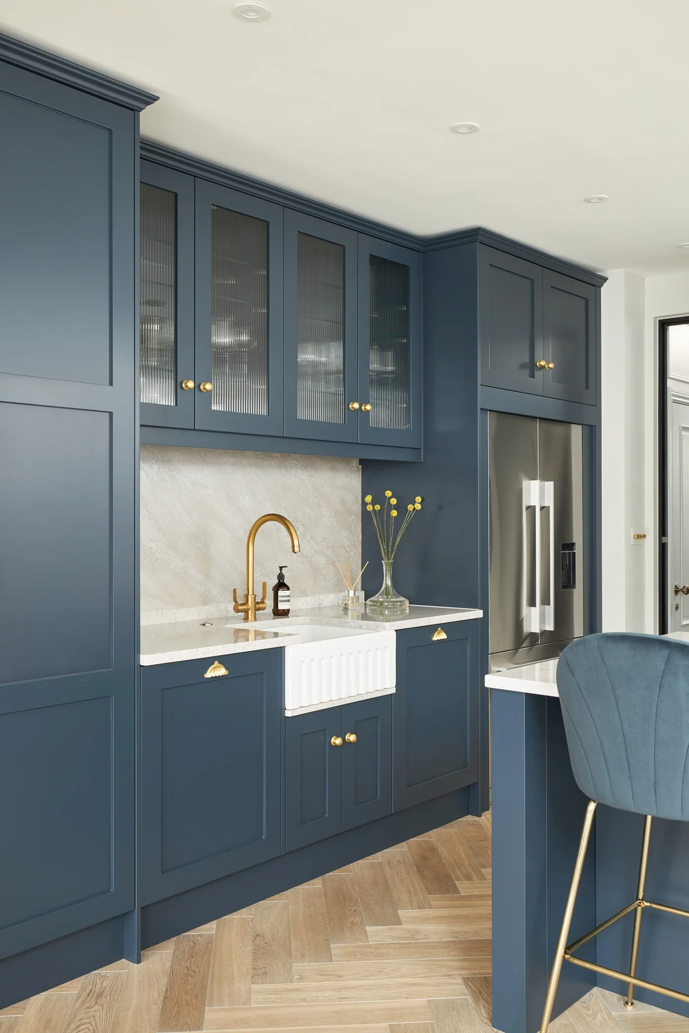 Fluted Glass Cabinet Doors Soften Deep Blue Kitchens
