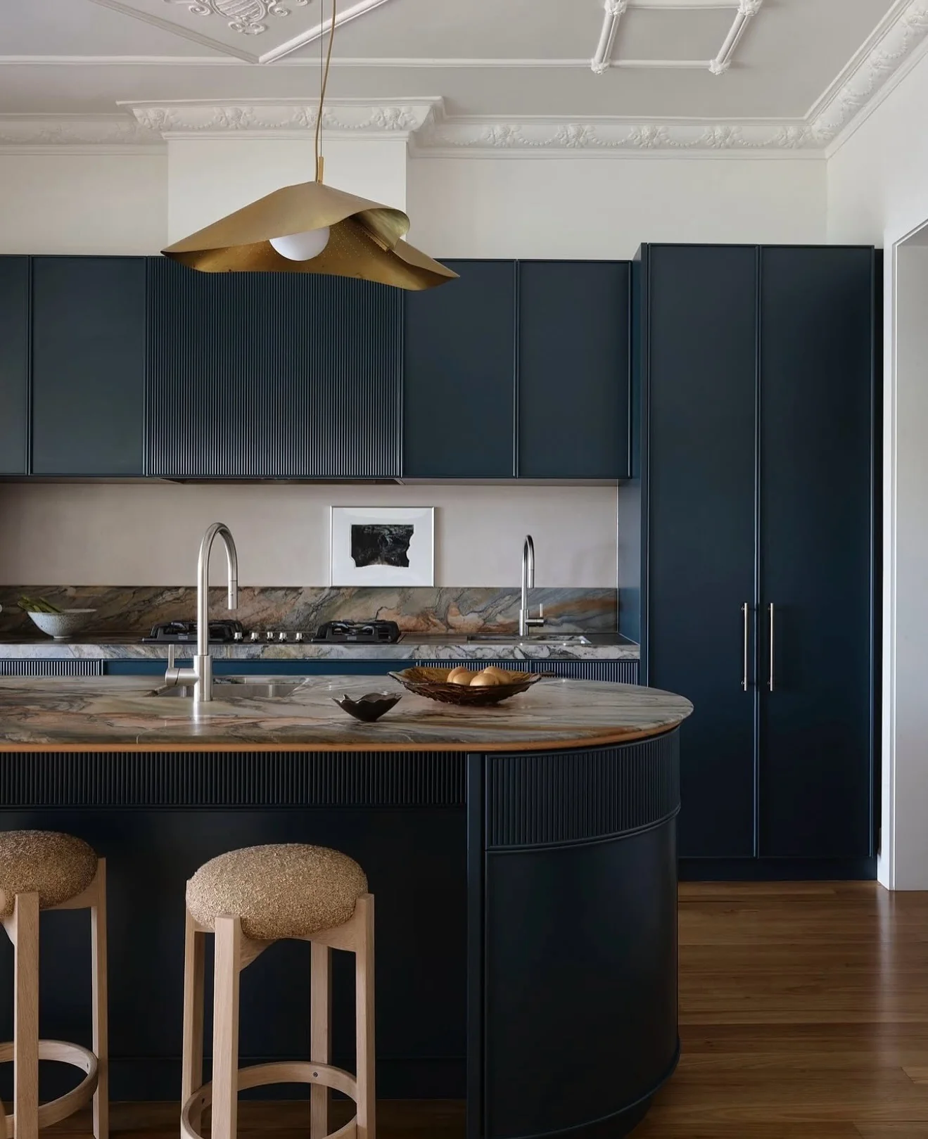 Dark Blue Island Features Fluted Paneling Detail
