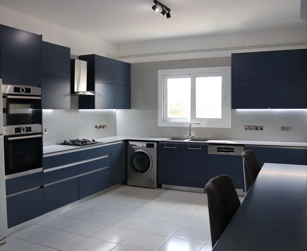 Dark Blue Cabinets with Integrated LED Lighting