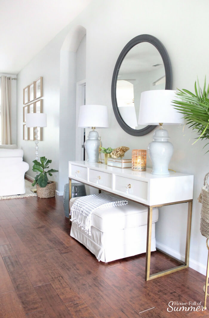White Console Table With Gold Legs Creates a Glamorous Entry