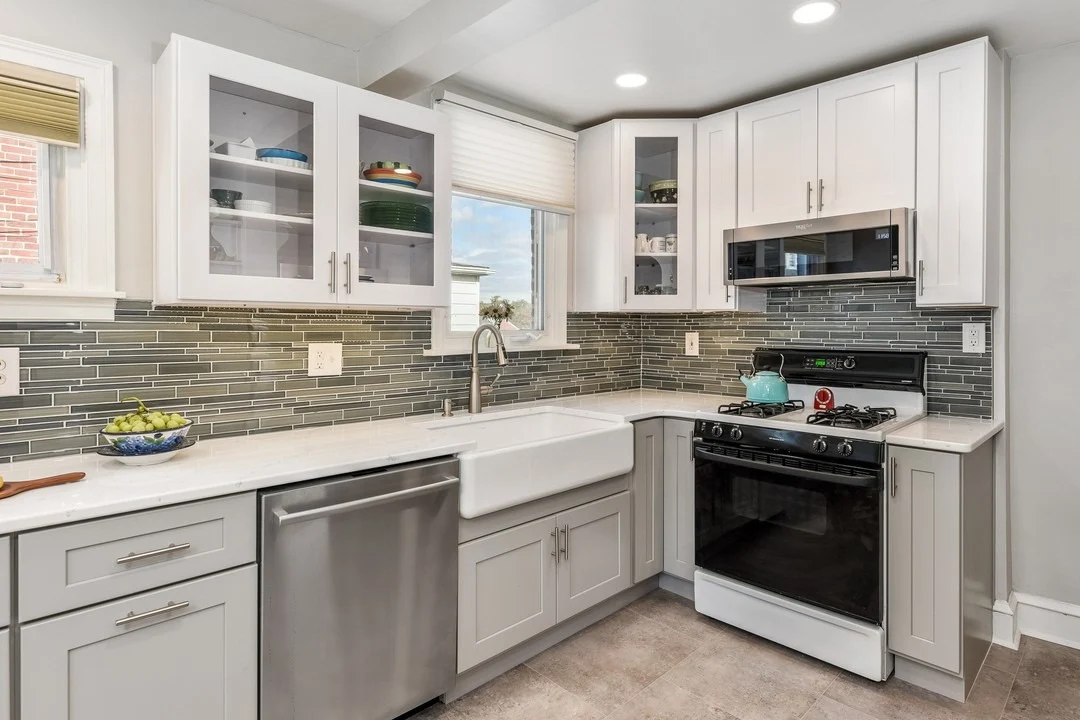 Horizontal Grey Glass Tile Backsplash Adds Linear Interest