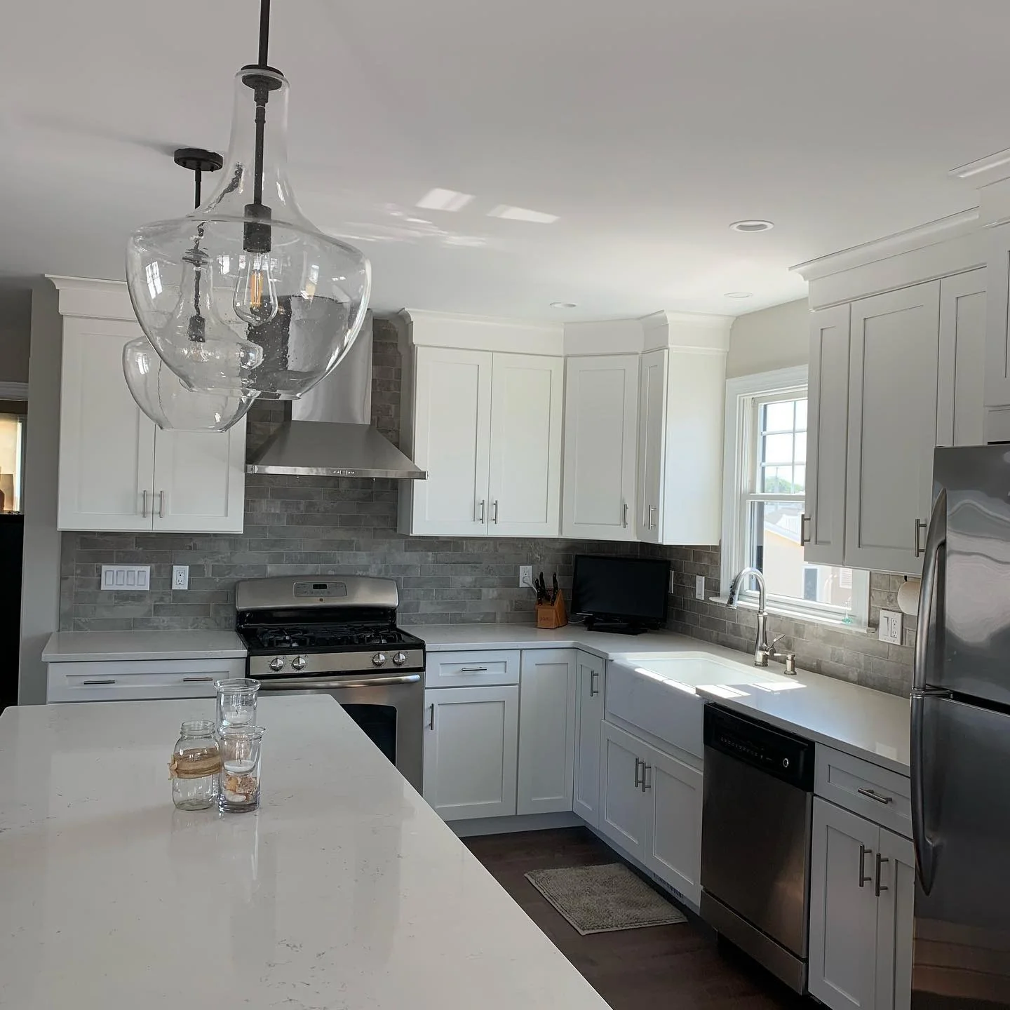Clear Glass Pendant Lights Add Airy Volume Above Island