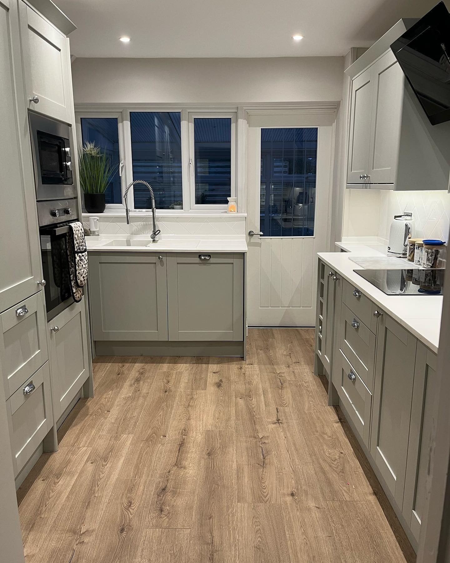 Matte Wood-Look Flooring Grounds Grey and White Kitchen