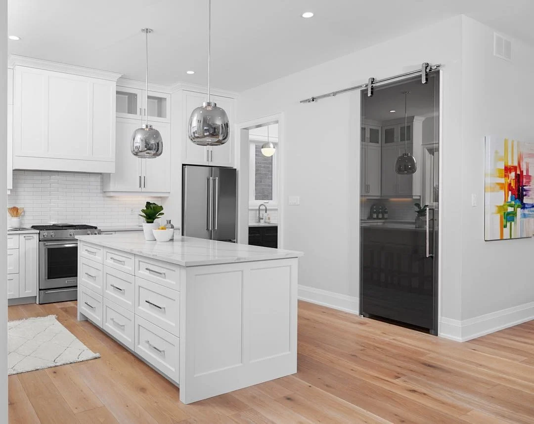 Chrome Pendant Lights Add A Reflective Touch Above Island