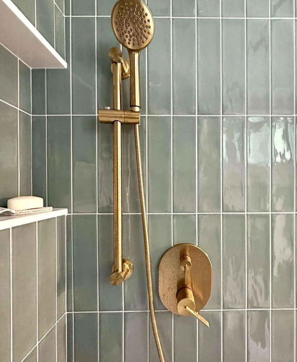 Pale Green Subway Tiles Create a Serene Shower Backdrop