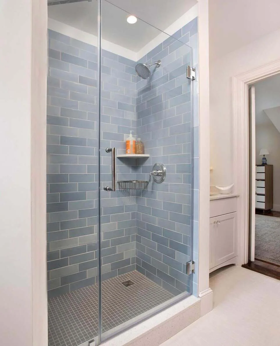 Subtle Blue Subway Tile Creates a Serene Shower Space