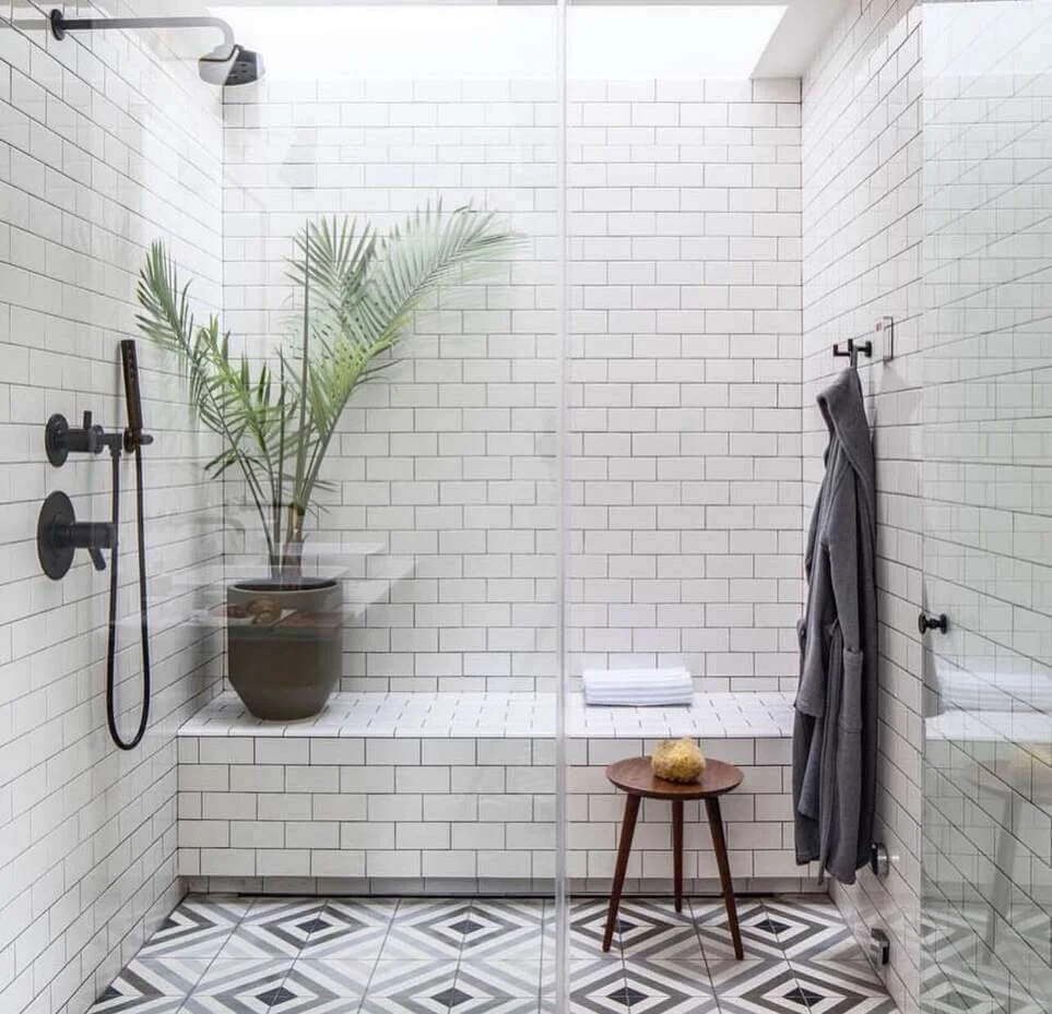 Geometric Floor Tile Creates a Striking Shower Contrast