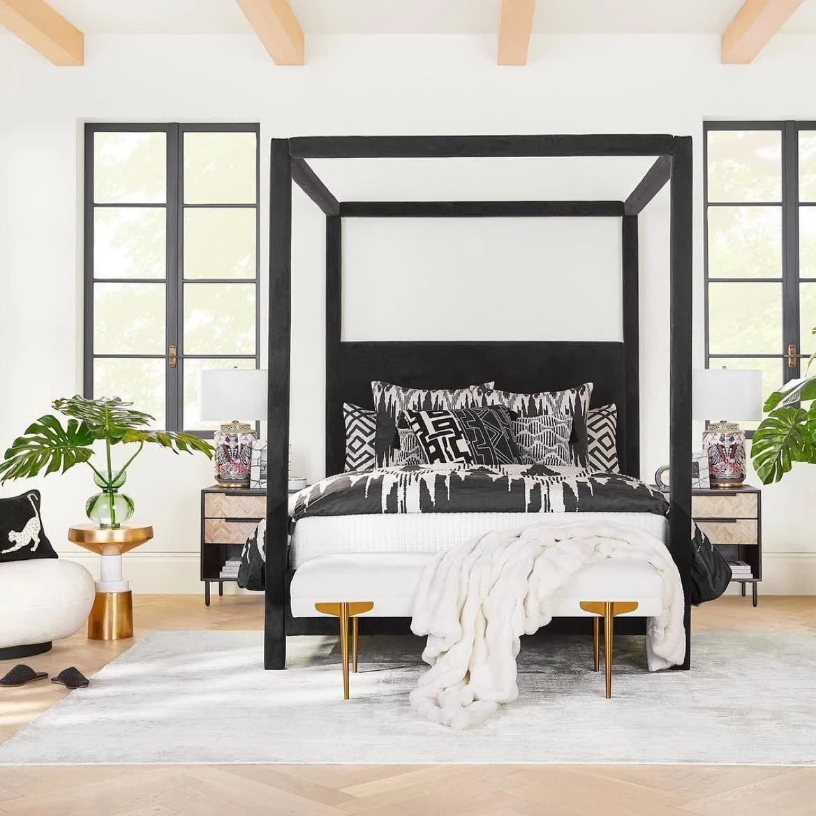 Black Canopy Bed Anchors a Monochromatic Geometric Scheme