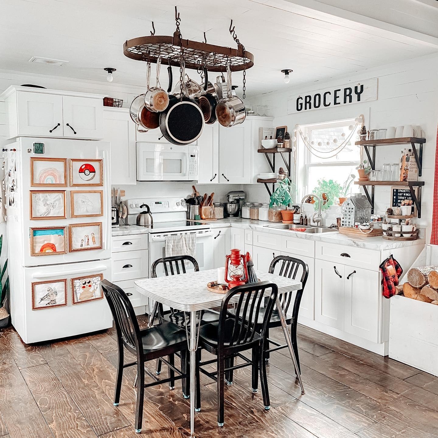 Hanging Pot Rack Utilizes Vertical Space Above Kitchen Table