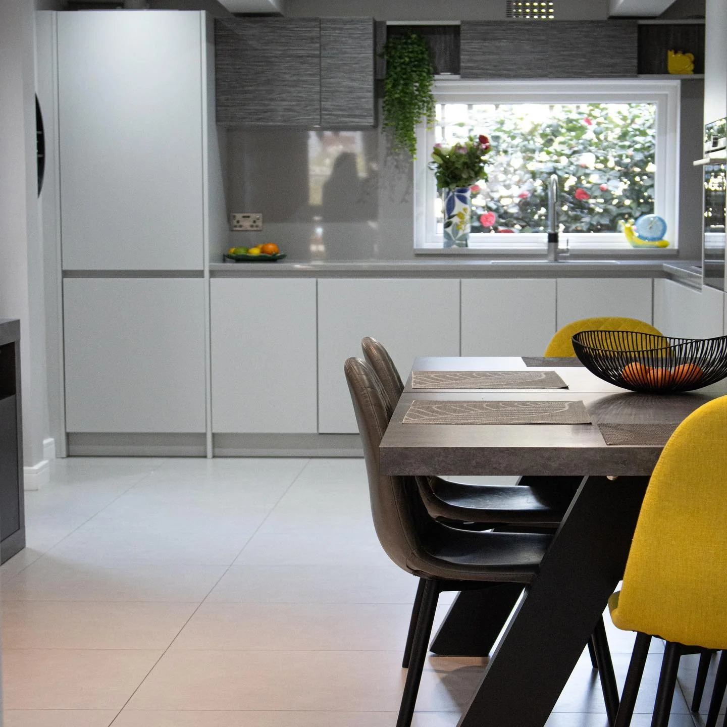 Anchor Your Kitchen with a Dark Metal X-Leg Table