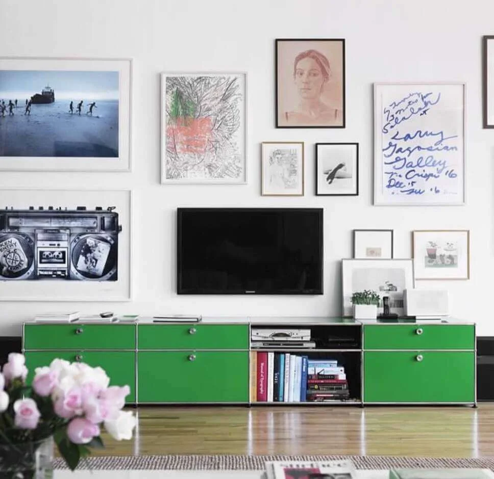 Bold Green Cabinets Add a Pop of Color Under the TV