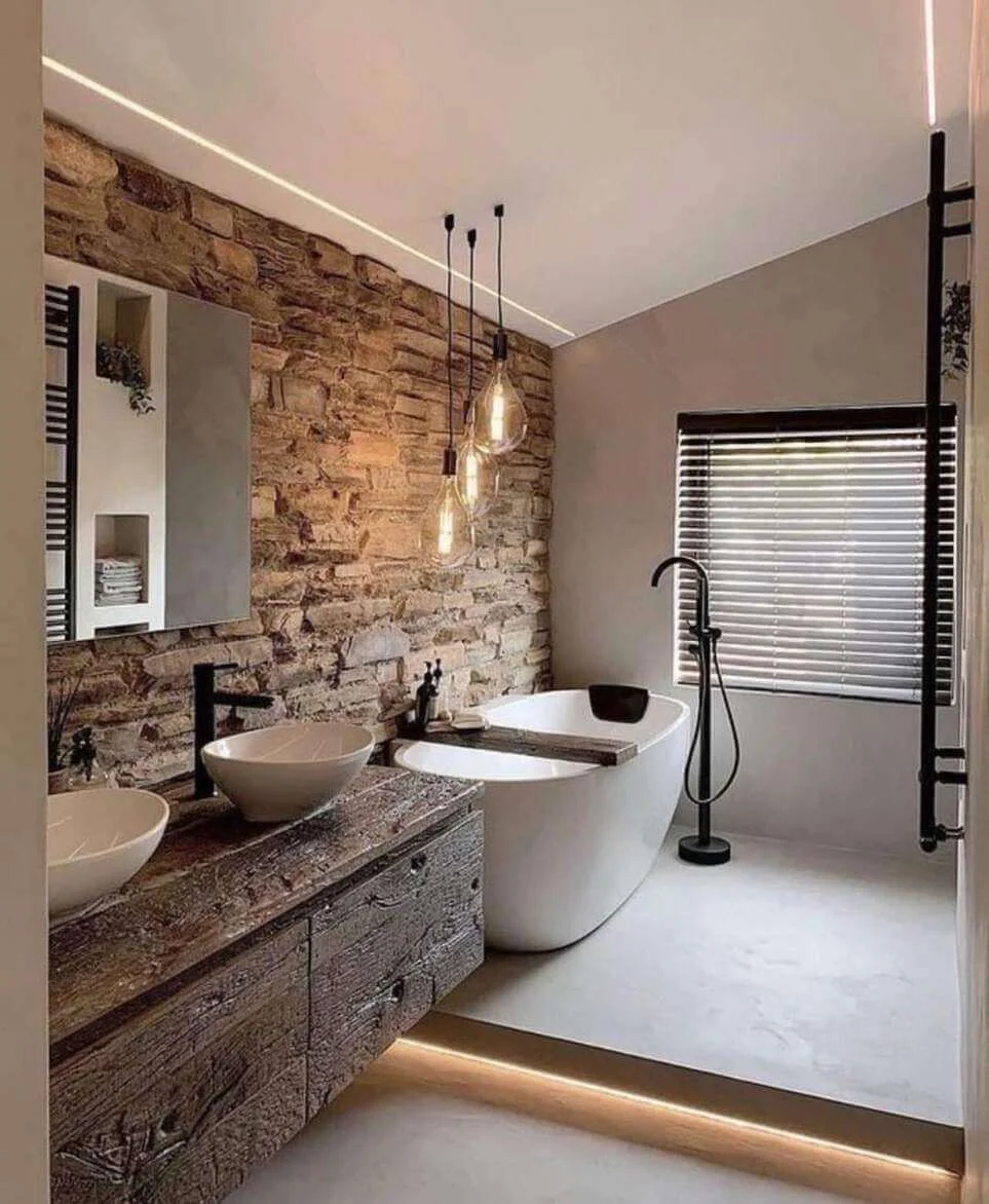 Stone Accent Wall Adds Rustic Texture Behind Freestanding Tub