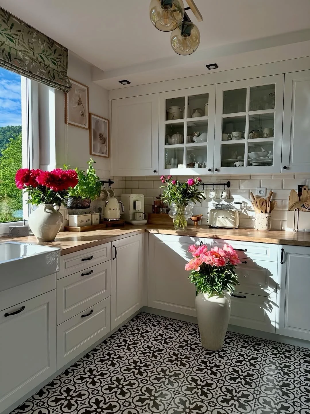 Tall White Vase Grounds a Corner With Peonies